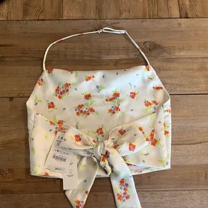 Satin, floral, tie back, crop top with adjustable strap around the neck.